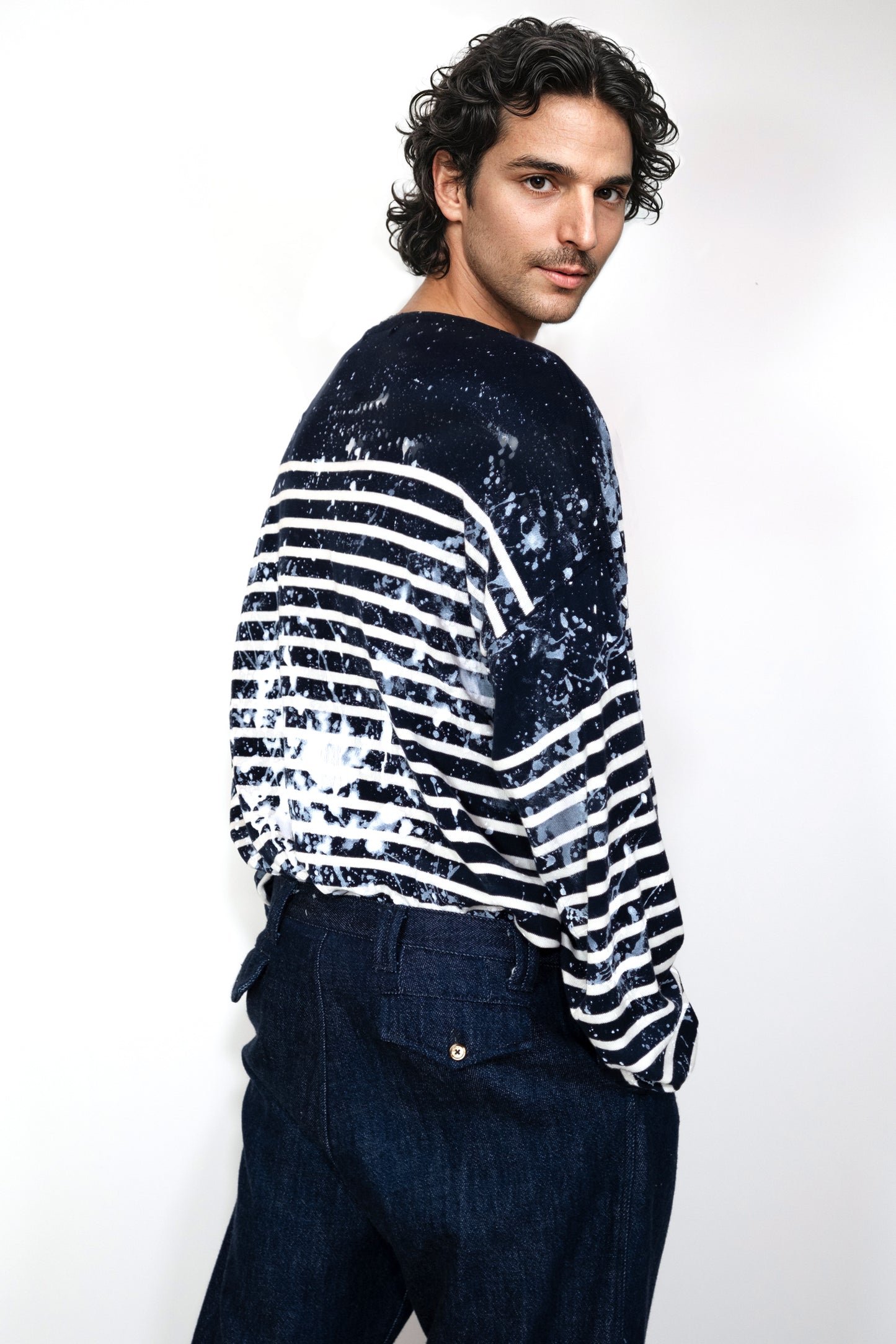 Men’s cotton Breton shirt with distinct navy stripes and subtle stains, designed for a unique and fashionable look
