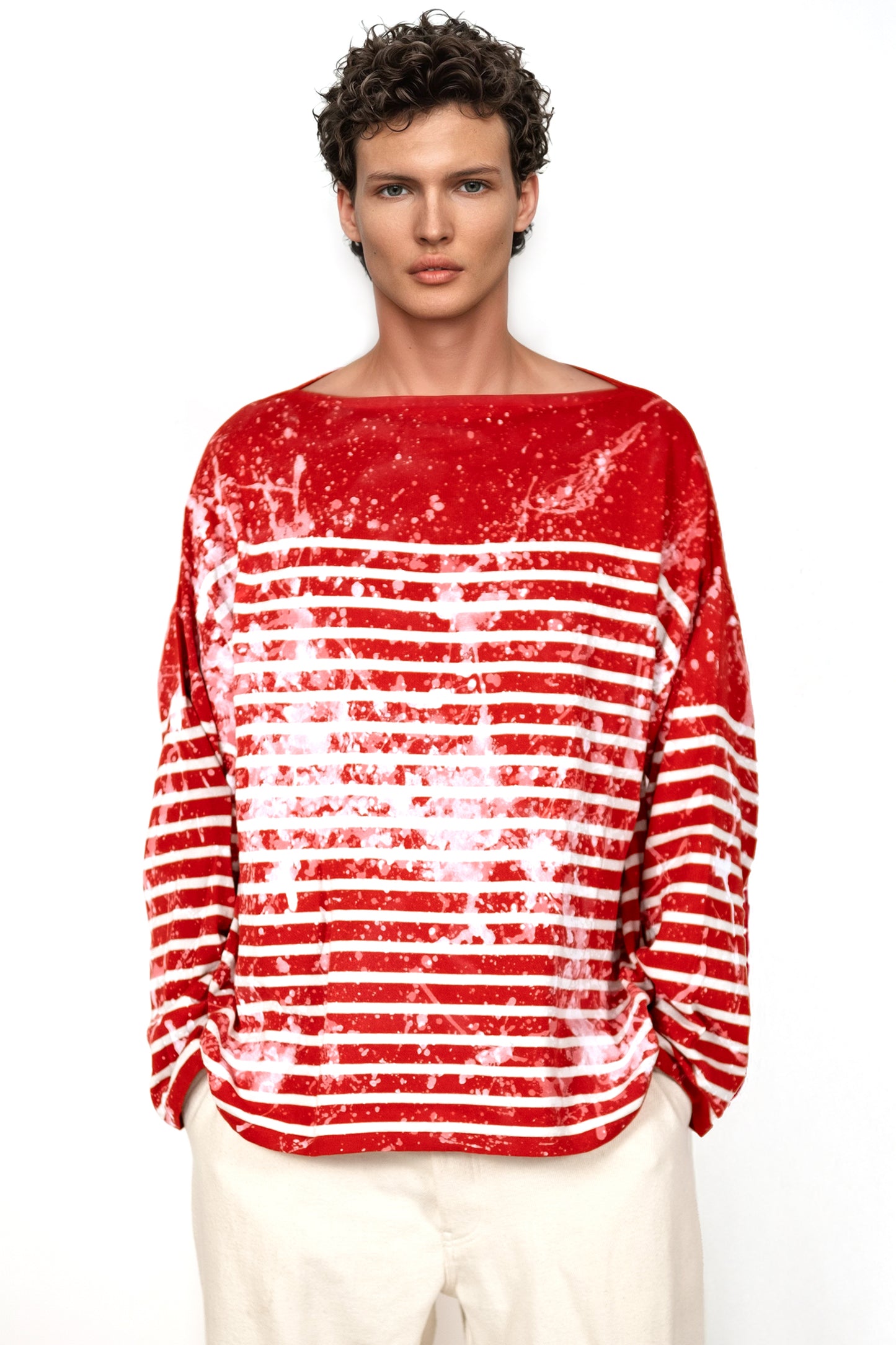 Contemporary cotton top with artisanal red stripe pattern and clean silhouette