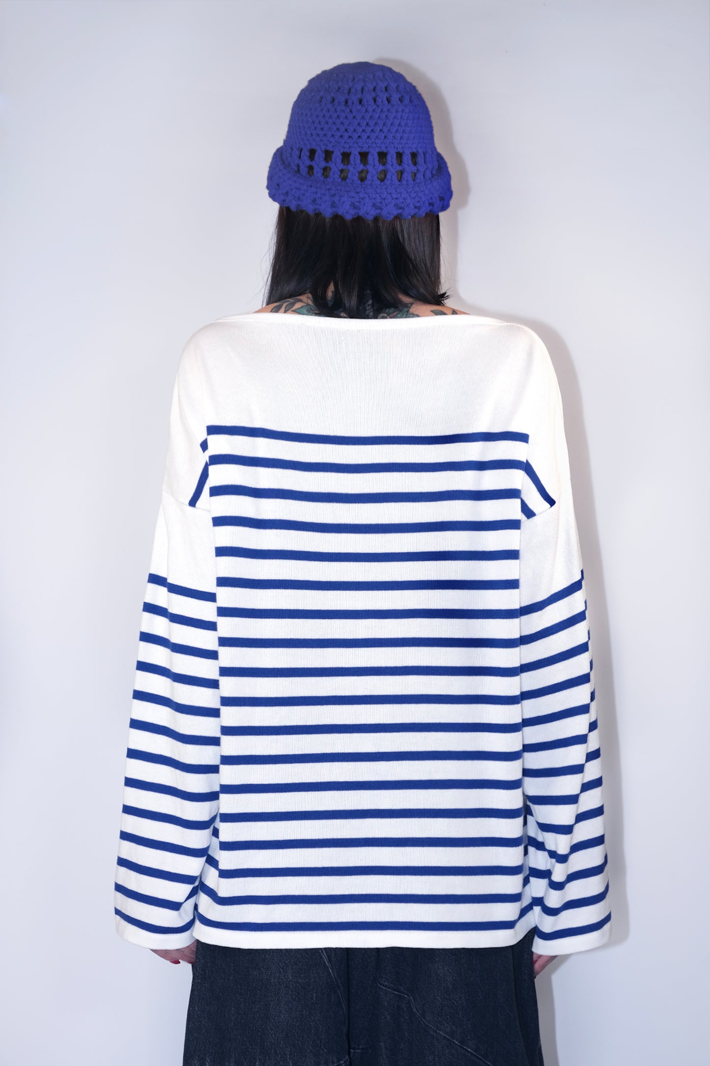 back view of the women's boat neck Breton shirt with white and blue stripes, featuring a slightly oversized fit and stylish Marinière design.